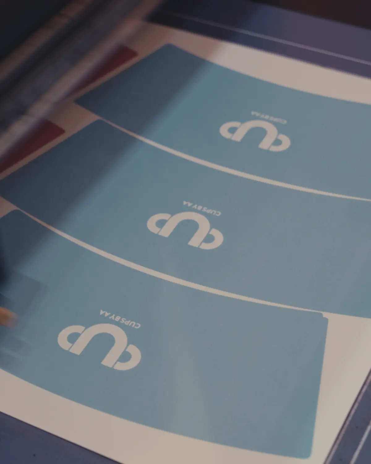 Printed fan blanks on the cutter bed, before they are cut from the sheet